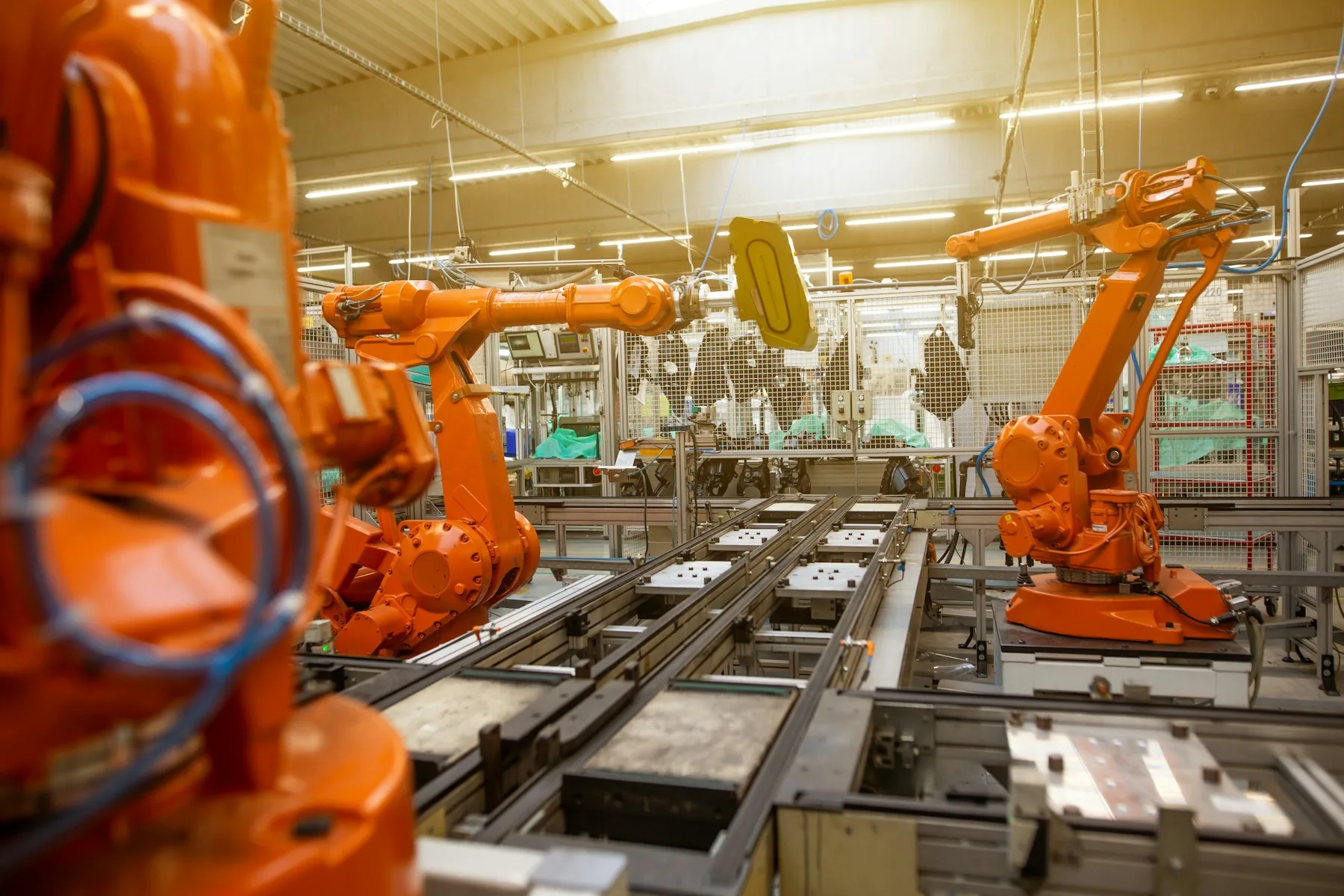 Industrial robots operating on a precision manufacturing line